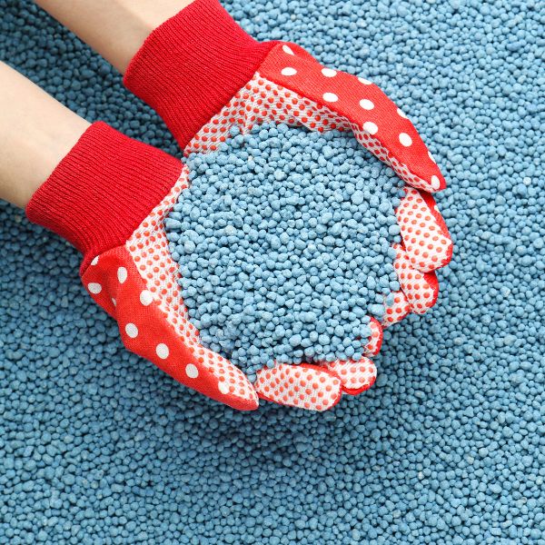 Pile of Granular Mineral Fertilizer over Grains